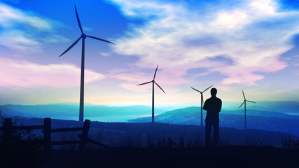 Fototapeta na wymiar Standing man on a background of a beautiful landscape with wind turbines