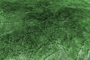 Pattern of sea waves toned in dark green and white