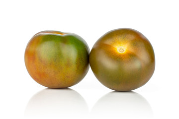 Group of two whole round fresh greenish red tomato isolated on white background