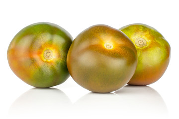Group of three whole fresh greenish red tomato isolated on white background