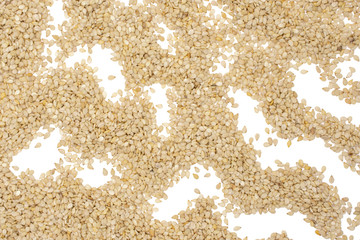 Lot of whole unpeeled sesame seeds flatlay isolated on white background