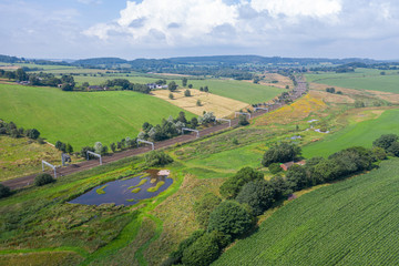 Fototapeta na wymiar Rail Tracks Across British Countryside at Summer