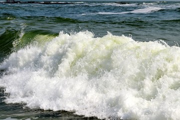 Huge wave is crashing on the beach