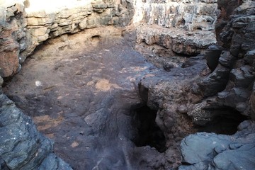 walking between ravines and old house