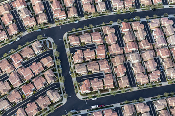 Aerial view of dense tract home rooftops in Los Angeles, California.