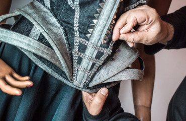 Fashion designer working on his new creation.
