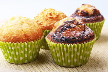 Assorted with Delicious homemade cupcakes with raisins and chocolate isolated on white background. Muffins. Top view. Copy space.