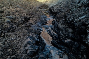 walking between ravines and old house