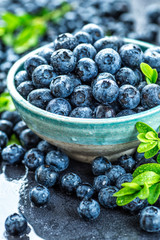 Fresh blueberries background with copy space for your text. Blueberry antioxidant organic superfood in a bowl concept for healthy eating and nutrition