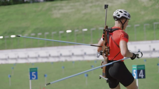 Portrait of Caucasian male professional biathlete practicing on a shooting range during mid-season practice in summer. ARRI Alexa Mini with Cooke S4 prime lenses RAW graded footage