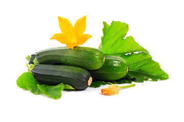 Zucchini or green marrow squash with green leaves and flowers isolated on white background