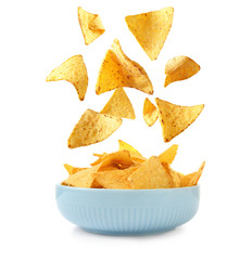 Ceramic bowl of Mexican nachos chips on white background