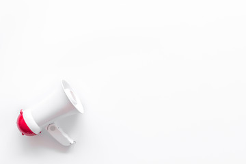 Fototapeta premium Attract attention with megaphone on white background top view copyspace