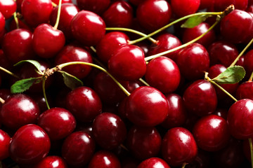 Delicious ripe sweet cherries as background, closeup view