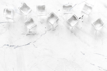 ice cubes on white marble table top view mock up