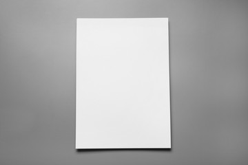 Blank paper sheets for brochure on grey background, top view. Mock up