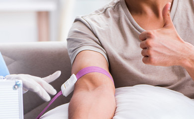 Patient getting blood transfusion in hospital clinic