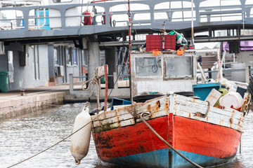 Fototapeta na wymiar artisanal fishing boats and ride in Punta del Este Uruguay on a stormy day
