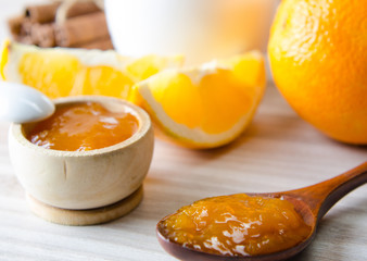 Cup of tea served with orange jam