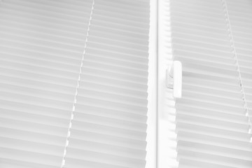 Window with modern horizontal blinds indoors, closeup