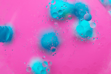 Abstract macro molecular pattern of colored oil bubbles on water. 