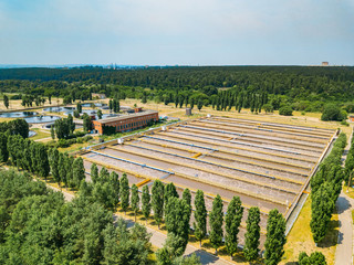 Modern wastewater treatment plant. Tanks for aeration and biological purification of sewage, aerial view from drone