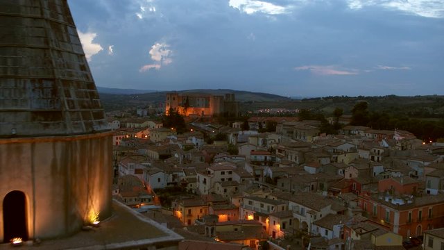 Drone pulling back over the crowned ancient town of Melfi in Italy. 