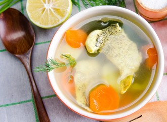 Fish soup served on the table in plate