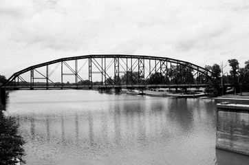 Old bridge over calm water