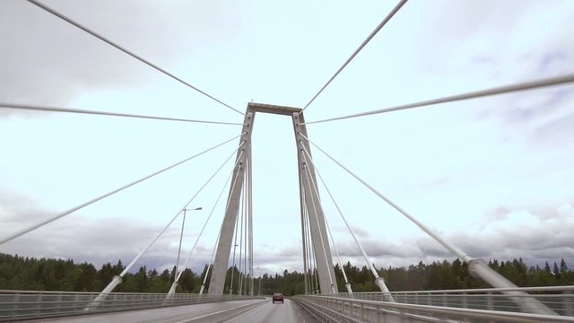 4K POV driving across cable-stayed Kolback bridge in Ume&aring;, Sweden, slowly tilting up at tower
