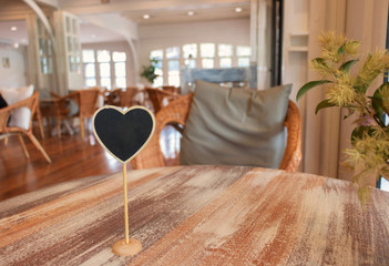 empty sign on wooden table in coffeehouse