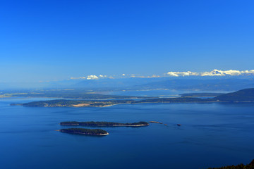 Panoramic view of the San Juan Islands with Mount Baker in the background as seen from Mount Constitution on Orcas Island, Washington