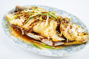 Chinese national dish steamed flower yellow croaker on white background
