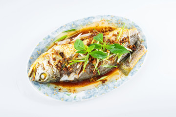 Chinese national dish steamed flower yellow croaker on white background