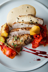 macro view of sliced baked meat with grilled vegetables