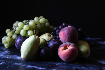 Still life fruits, grape,plum,peach and pear