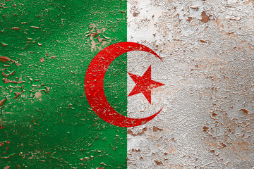 National flag of Algeria  on old peeling wall background.The concept of national pride and symbol...