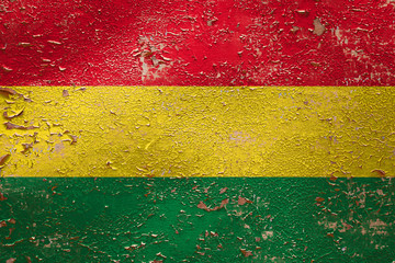 National flag of Bolivia  on old peeling wall background.The concept of national pride and symbol...