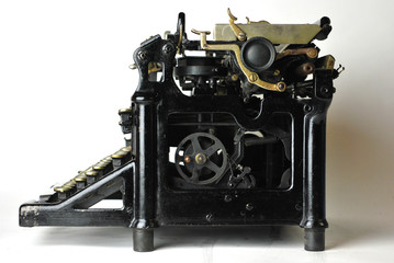 Restored antique typewriter on white background