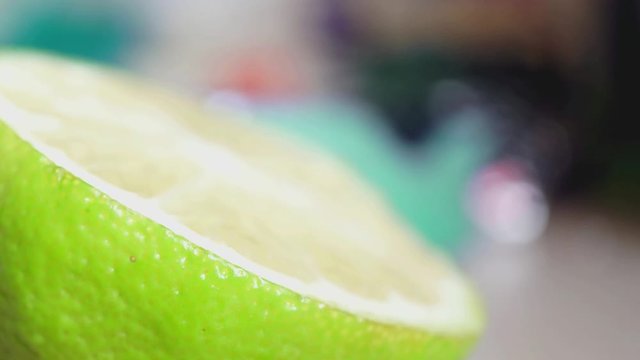 Zoom out shot of a half lemon sklice.