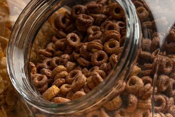 Cereals, granola in a jar texture close-up, macro