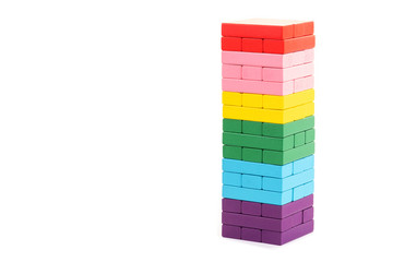 stacked colorful wooden blocks toys on white background. Creative, diverse, expanding, rising or growing.