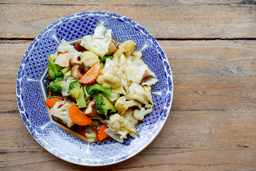 Stir fired vegetables on wood table