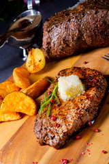 Butter Beef Steak with herbs and potato wedges