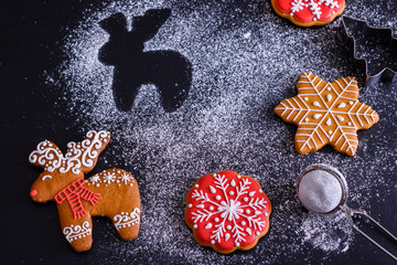 Christmas homemade gingerbread cookies on a dark background