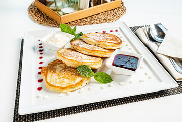 fresh pancakes with sour cream and jam