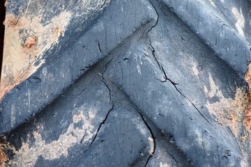 Texture and cracked on the  big old Tractor tire..