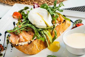 sandwich with salted salmon and poached egg