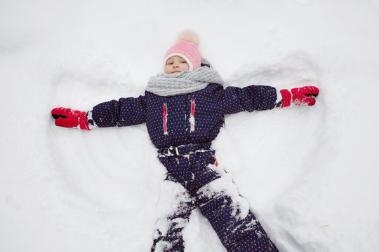 Young girl representing a snow angel.