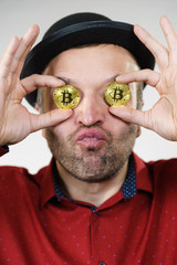 Man having bitcoin in eye